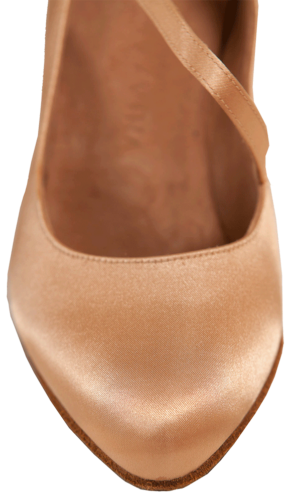 Pointed toe of nude, satin ballroom dance shoes